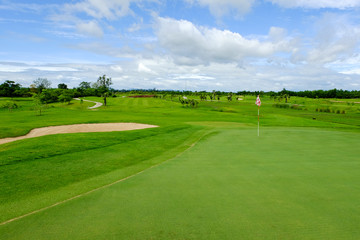 green in golf course with nice sky background day time