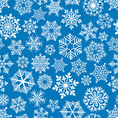 Snowflakes seamless pattern vector illustration. White snowflakes on blue background