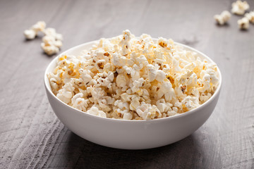 Olive oil popped popcorn in a porcelain bowl horizontal shot