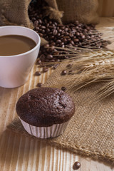 breaksfast and cup of coffee with coffee beans background.