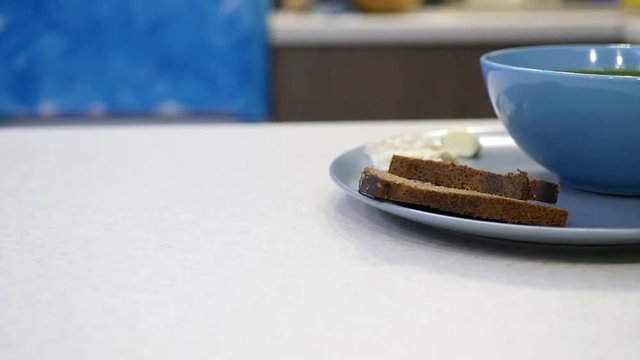soup in a blue plate