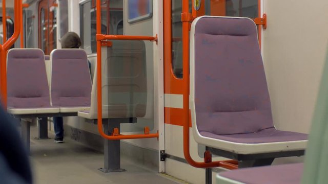 View of empty seat place in subway riding train, modern clean railway carriage. Prague, Czech Republic