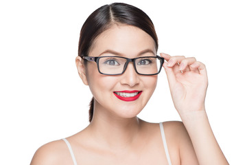 Beauty asian model girl with perfect skin wearing glasses, isola