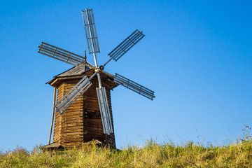 Fototapeta na wymiar Old wooden windmill in the village of Nizhnya Sinyachikha in the Urals in Russia.