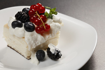 Cremeschnitte with berries closeup