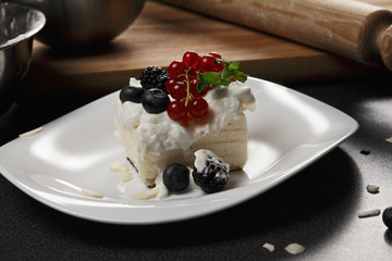 Cremeschnitte with berries and ingredients closeup