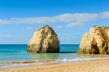 Fototapeta na wymiar Rocks on the beach of Praia da Rocha, Portimao Coast. Algarve region. Portugal