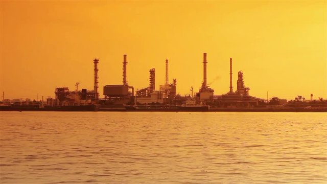 River and oil refinery factory.Time lapse shot.