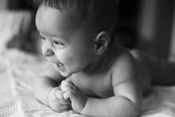 First smile of the baby black and white
