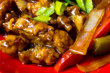 asian wok - Grilled meat ribs on the plate with hot sauce