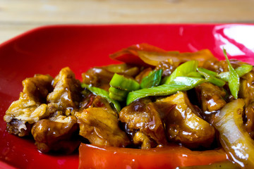asian wok - Grilled meat ribs on the plate with hot sauce