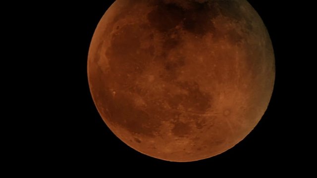 4K footage of Red Moon in the dark sky 