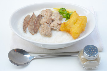 Congee with pork and ginger slices on top Rice porridge with pork 
