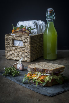 Vegan sandwiches for picnic with roasted carrots, pea spread, an