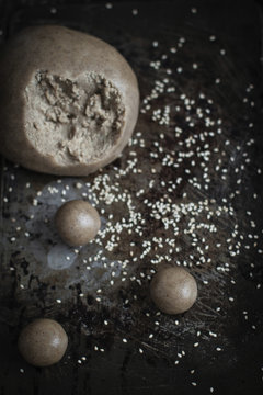 Work in progress for tahini cookies: making small balls with dou