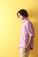 Obraz premium Handsome young man on yellow background