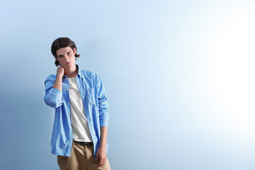 Handsome young man on blue background