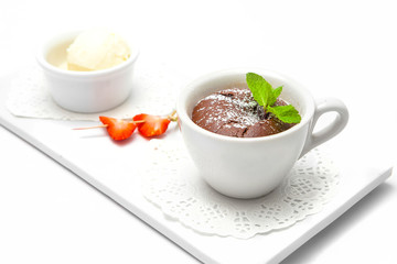 chocolate fondant in a white cup.