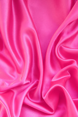 Obraz premium Smooth pink silk as background