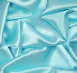 Smooth elegant blue silk as background