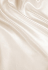 Fototapeta na wymiar Smooth elegant golden silk as wedding background. In Sepia toned