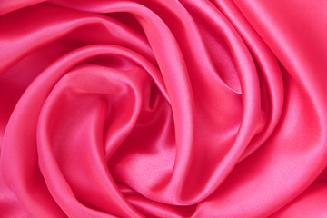Smooth elegant pink silk or satin as background