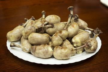 Cooking hot snack of chicken legs. Chicken legs inside-out for g