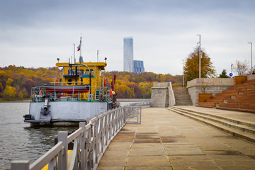 Beautiful autumn Moscow, Moscow River and boat. Luzhnetskaya emb
