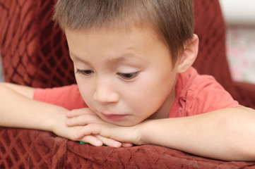 Boy surprised looking down at something