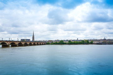 Old stony bridge in Bordeaux, France Europe