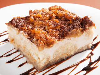 Homemade apple tiramisu cake topped with cinnamon and cocoa