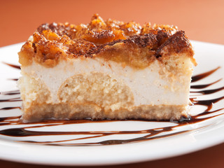 Homemade apple tiramisu cake topped with cinnamon and cocoa. Hor