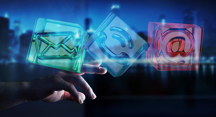 Businessman touching transparent cube contact icon with his fing