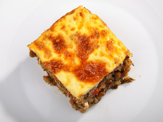Vegetarian moussaka from lentils, onion, peppers and eggs. Shot