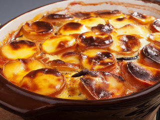 Potato casserole with smoked cheese. Baked. Close up