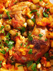 Chicken casserole with potatoes, beans, tomatoes, olives and par