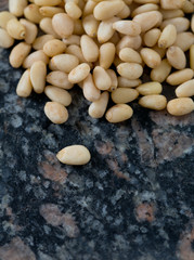 pine nuts on granite surface