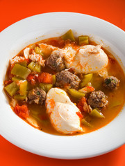 Tunisian soup with meatballs, vegetables and poached eggs. Verti