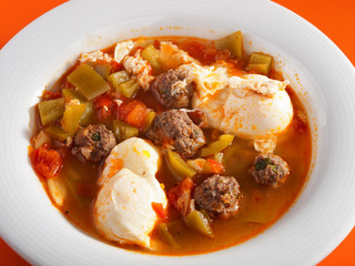 Tunisian soup with meatballs, vegetables and poached eggs. Horiz