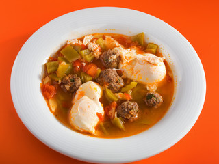 Tunisian soup with meatballs, vegetables and poached eggs