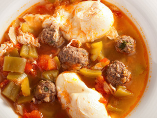 Tunisian soup with meatballs and eggs. Shot from above, horizont