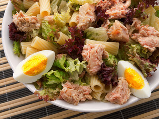 African tuna salad with eggs and pasta. Shot from above, horizon