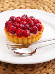 Homemade mini raspberry tart. Vertical shot