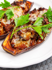 Baked stuffed eggplants with meat and cheese. Shot from above