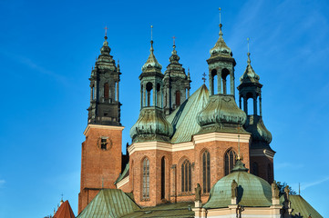 Fototapeta na wymiar chapels and towers Gothic cathedral church in Poznan.