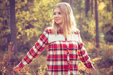 Young Woman walking outdoor wearing hipster plaid shirt Lifestyle Travel forest nature on background
