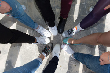 Closeup legs of people wearing classic shoes in a circle - obrazy, fototapety, plakaty