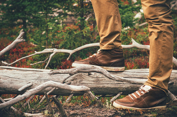 Feet Man walking Outdoor Travel Lifestyle Fashion trendy style forest nature on background film effects colors