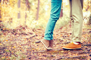 Couple Man and Woman Feet in Love Romantic  Outdoor Lifestyle with nature on background Fashion trendy style