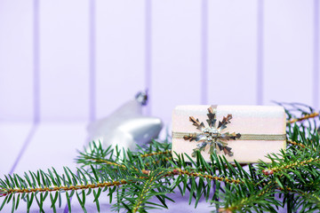 Christmas decoration on a purple striped background - selective